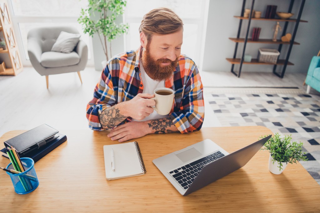 a participant having coffee during a virtual meeting