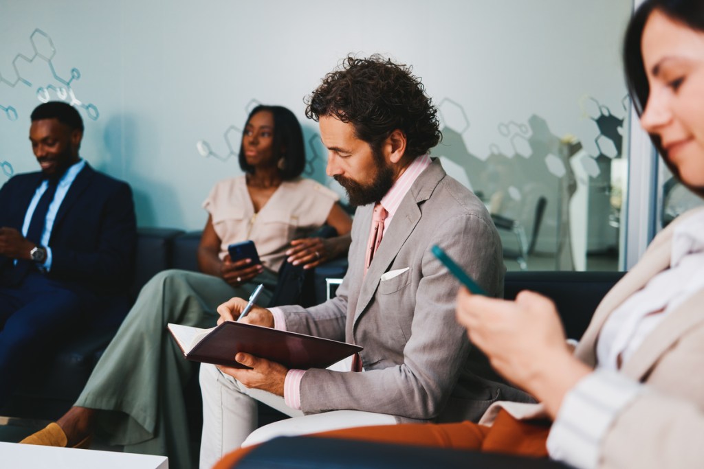 business professionals taking notes