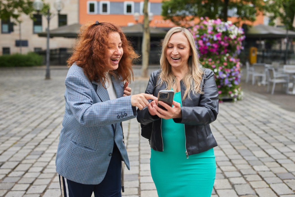 businesswomen taking selfie for an icebreaker activity