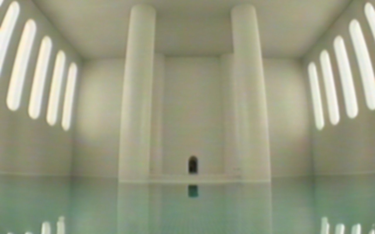 A pool reflects light in a massive empty room while a dark doorway lies ahead.