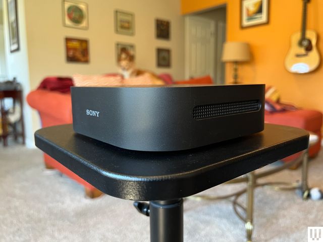 Image may contain: Furniture, Table, Lamp, Guitar, Musical Instrument, Art, Painting, Indoors, Interior Design, and Desk